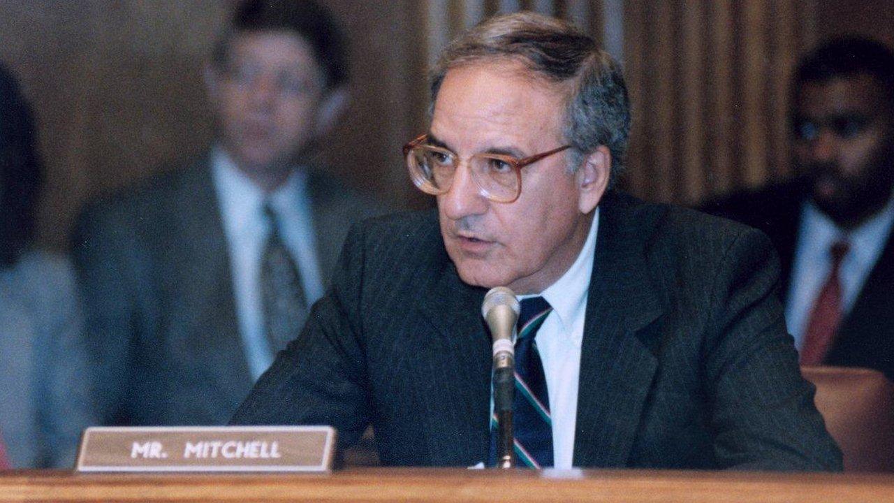 Senator George Mitchell seated at a committee meeting in 1984