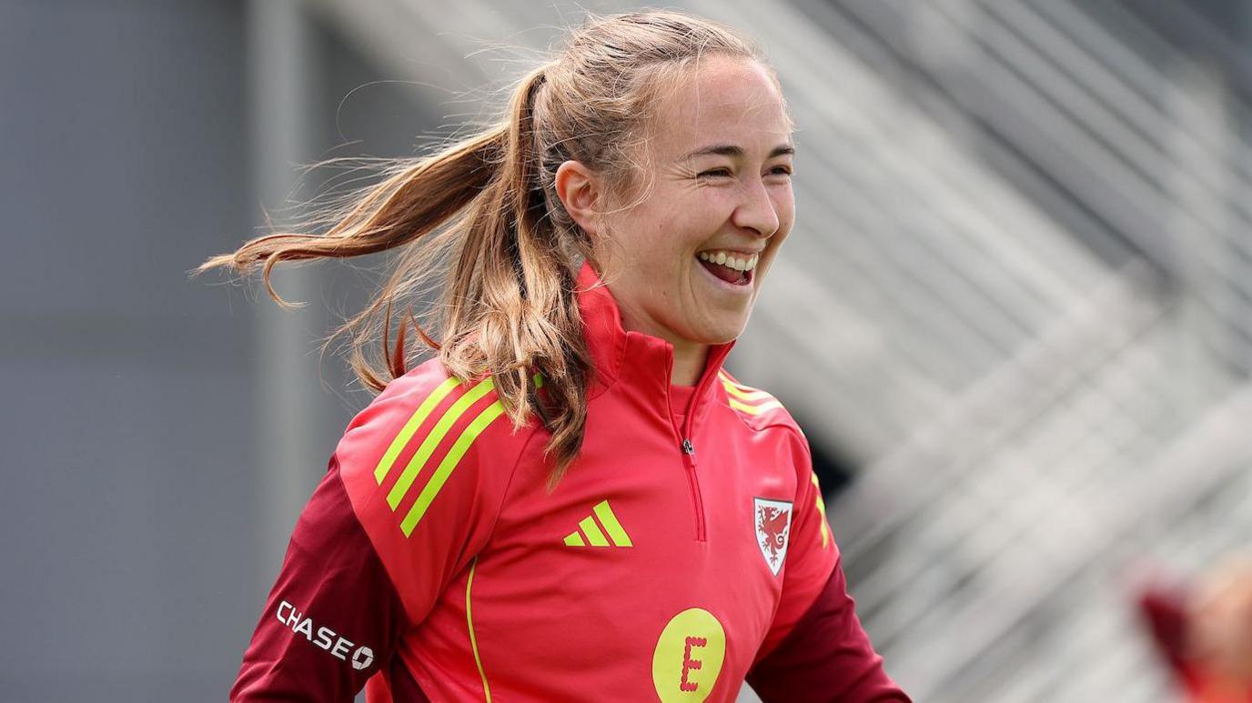Laura Hughes smiles during Wales training