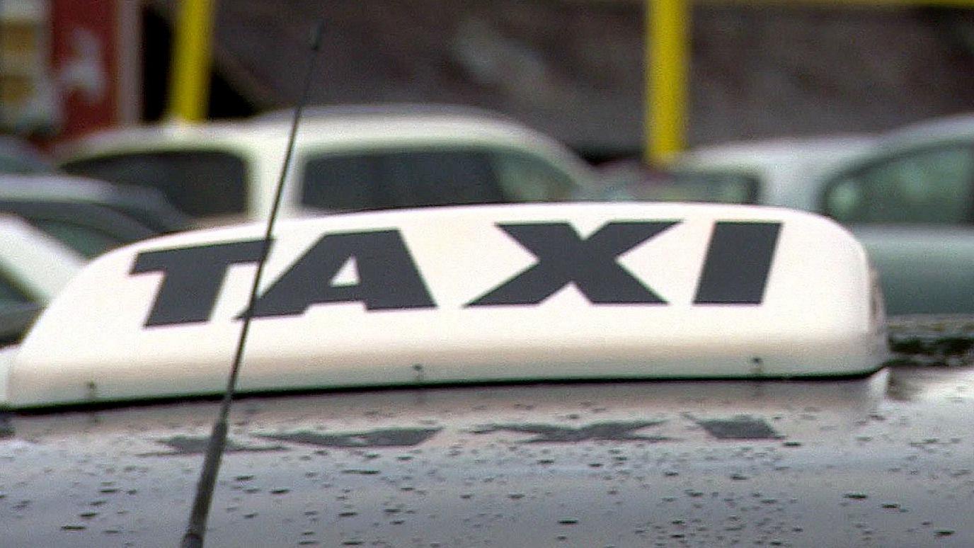 Taxi sign on cab roof