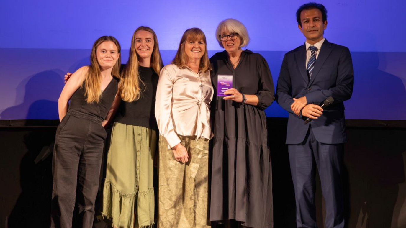 The Nai's House team receiving their award from Dr Hooman Soleymani Majd