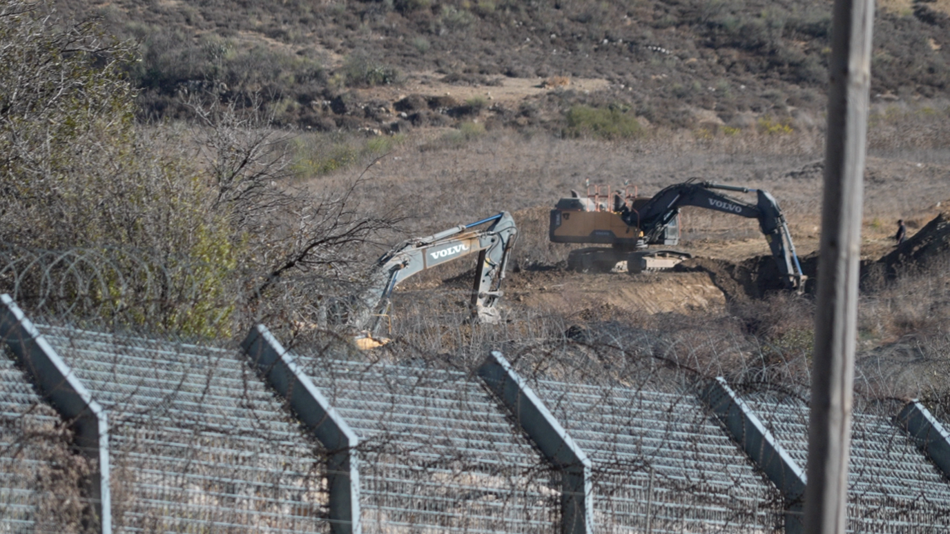 Excavators dig trenches near Majdal Shams, in the Israeli-occupied Golan Heights