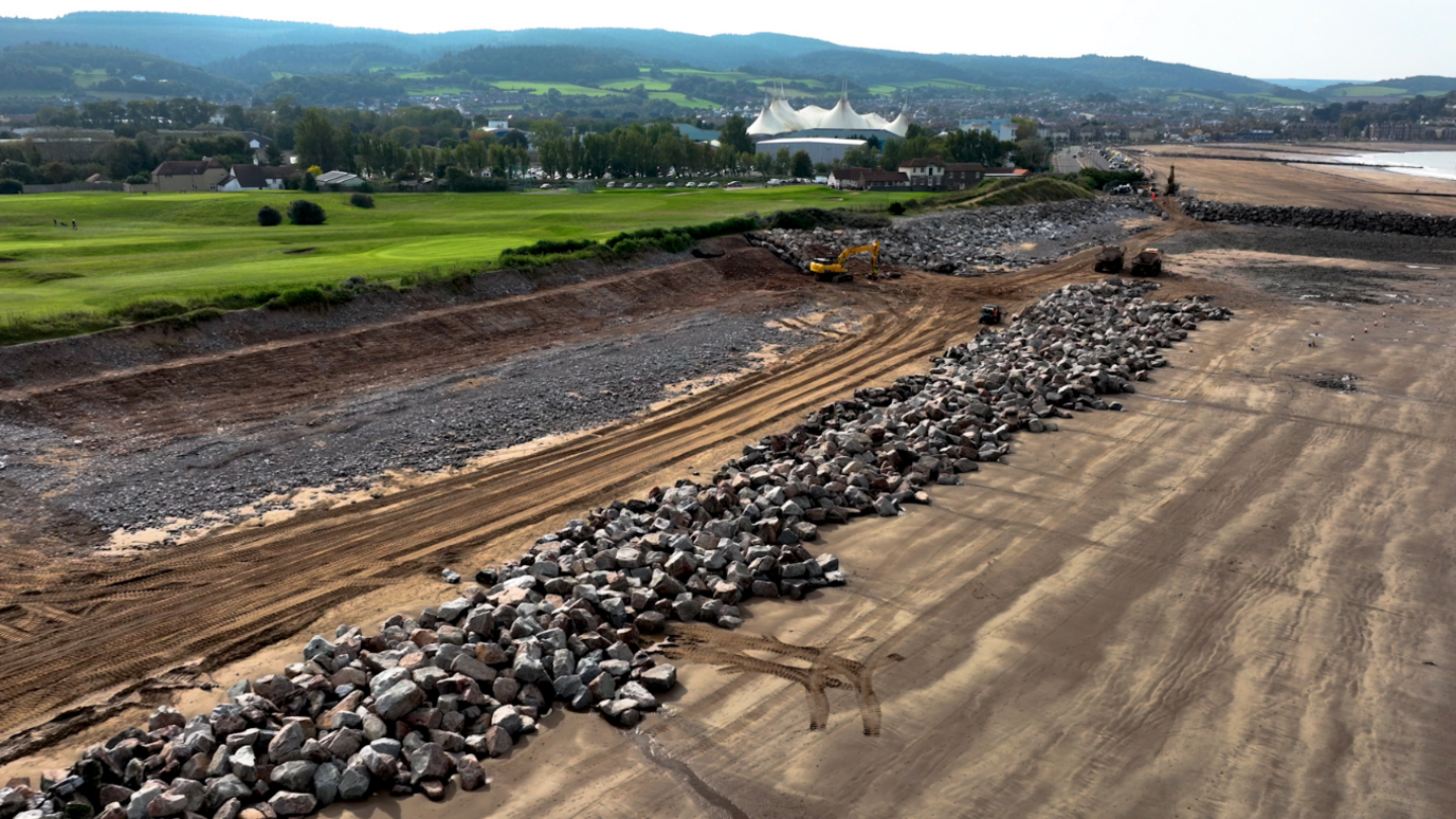 Rocks being installed on the coast