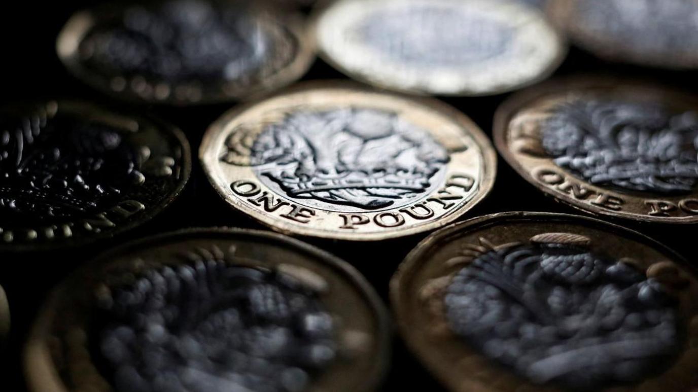 Pound coins stacked on top of each other
