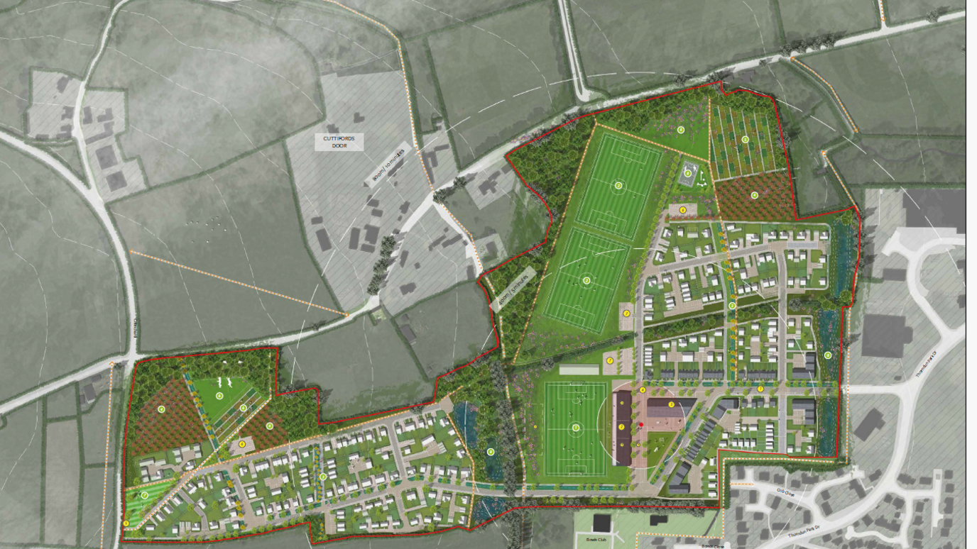 An aerial map illustration of the site showing the houses in two blocks either side of the new sports pitches