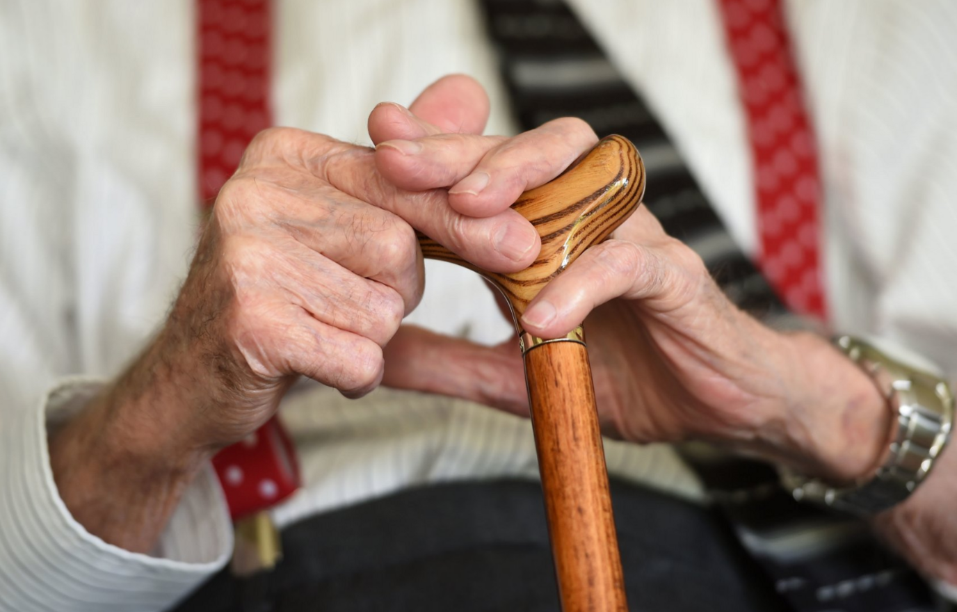 Generic photo of an elderly man's hands holding stick