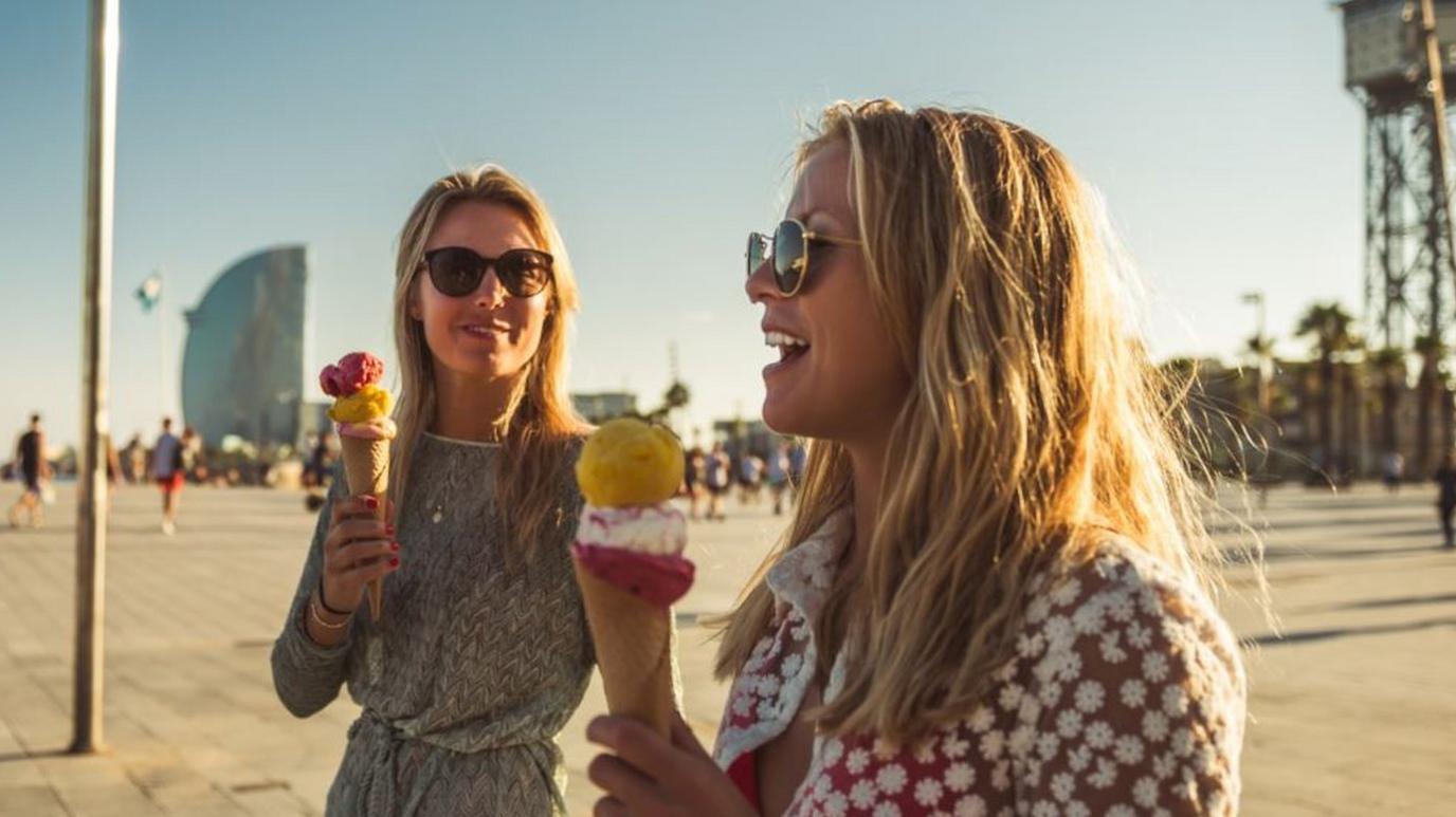 Two women eating ice cream on holiday