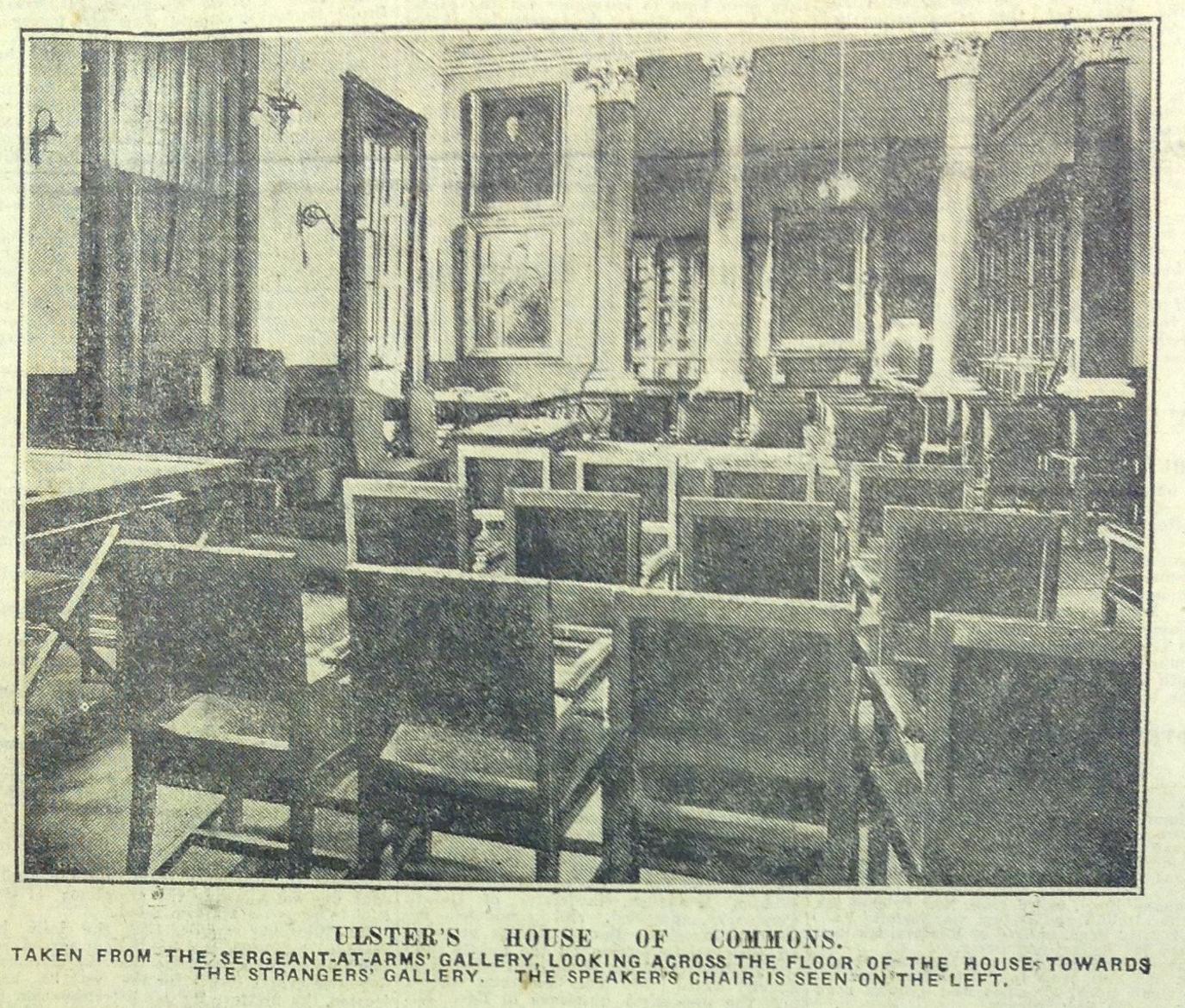 Black and white photo looking across the floor of the House of Commons in the Gamble Library