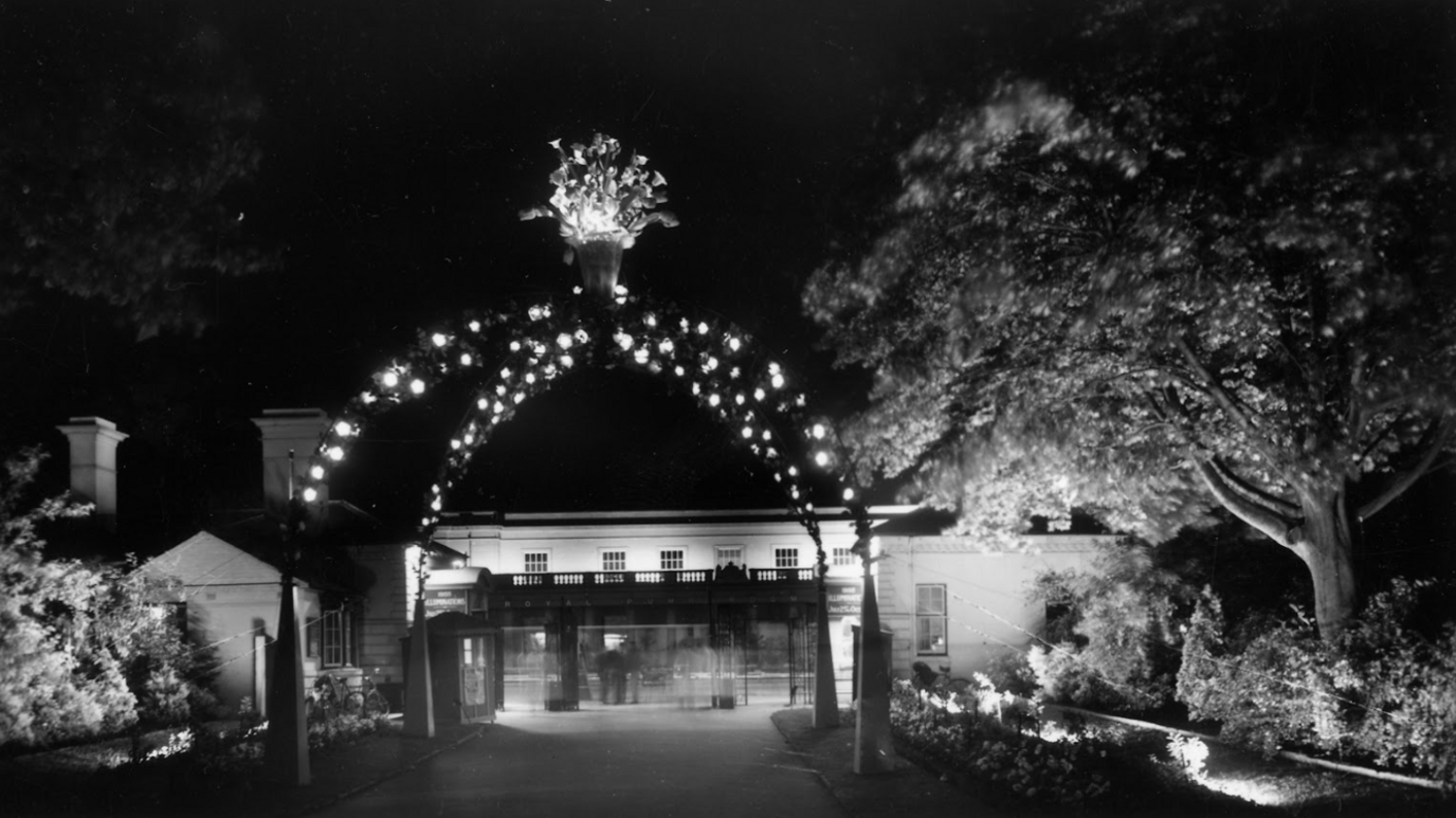 A black and white photo of an arch of lights in Jephson Gardens in 1950s