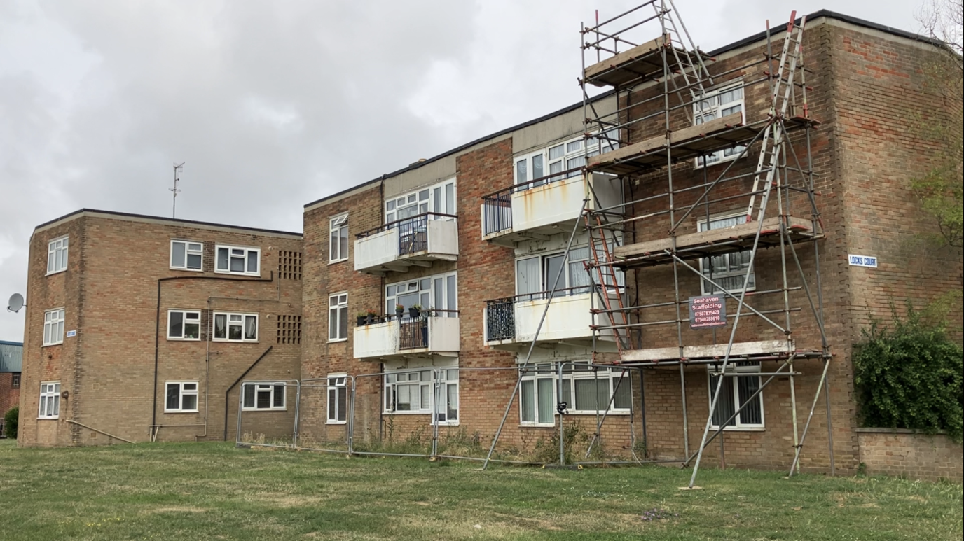 Exterior shot of Locks Court, Southwick, with scaffolding erected outside the block.