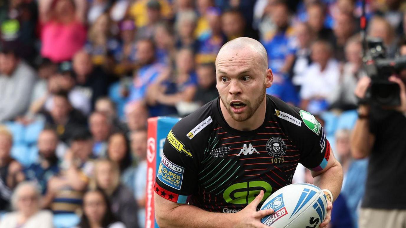 Wigan's Liam Marshall scores against St Helens