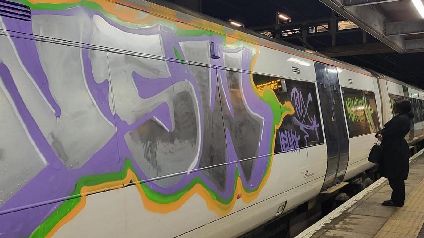 A train carriage covered in graffiti at Laindon railway station