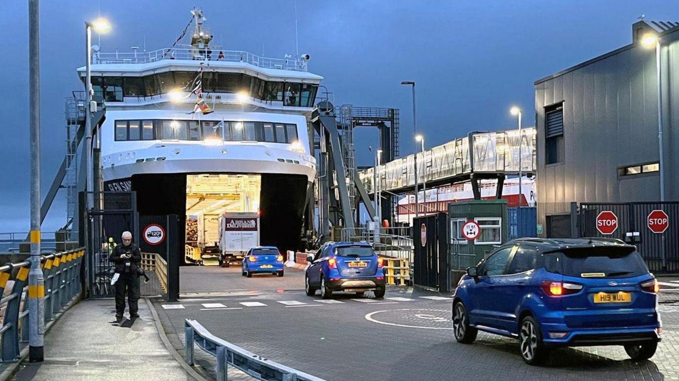 The Glen Sannox docked at Brodick Harbour. Cars enter via the ferry ramp