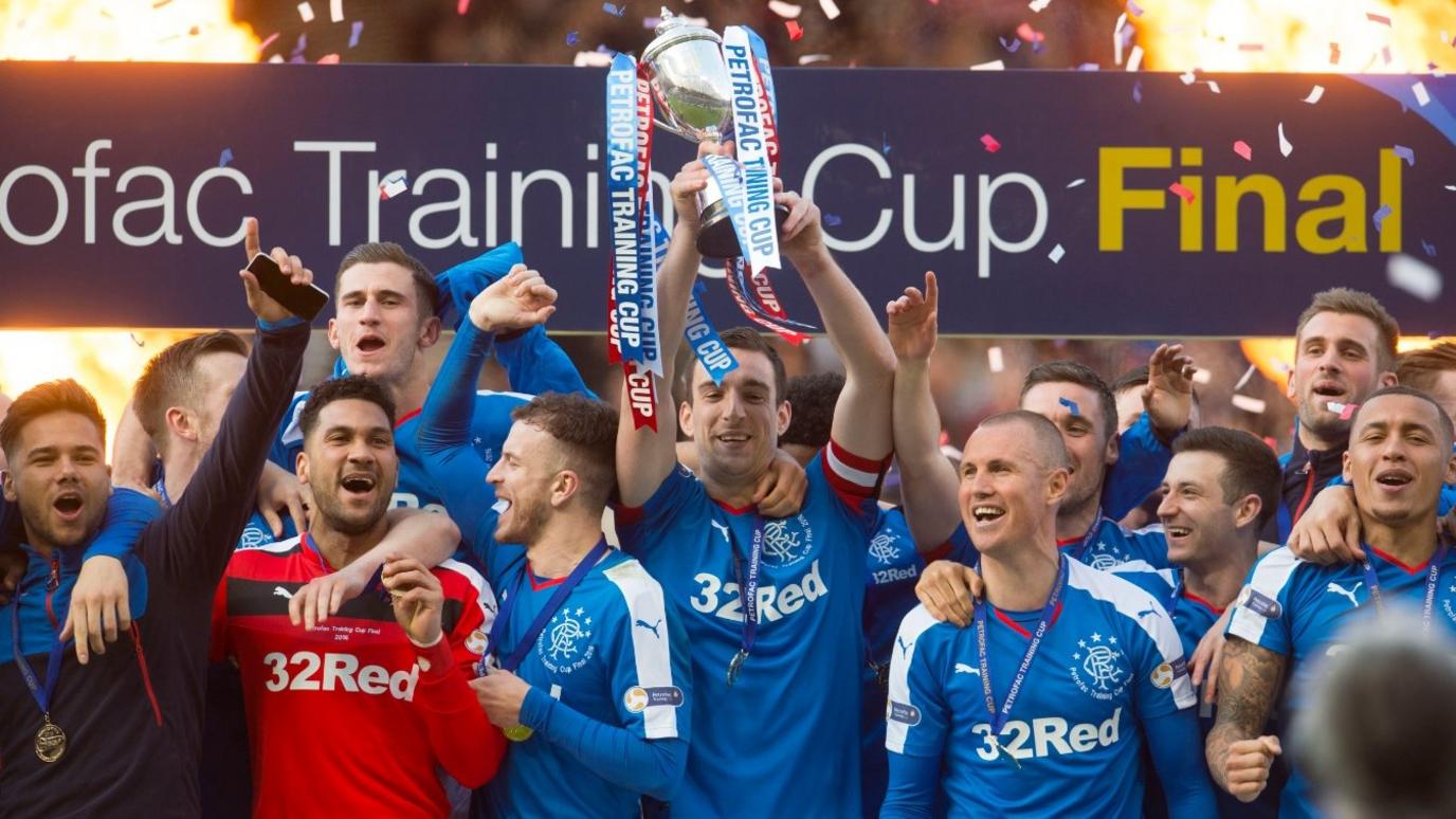 Rangers players celebrating with the Scottish Challenge Cup trophy