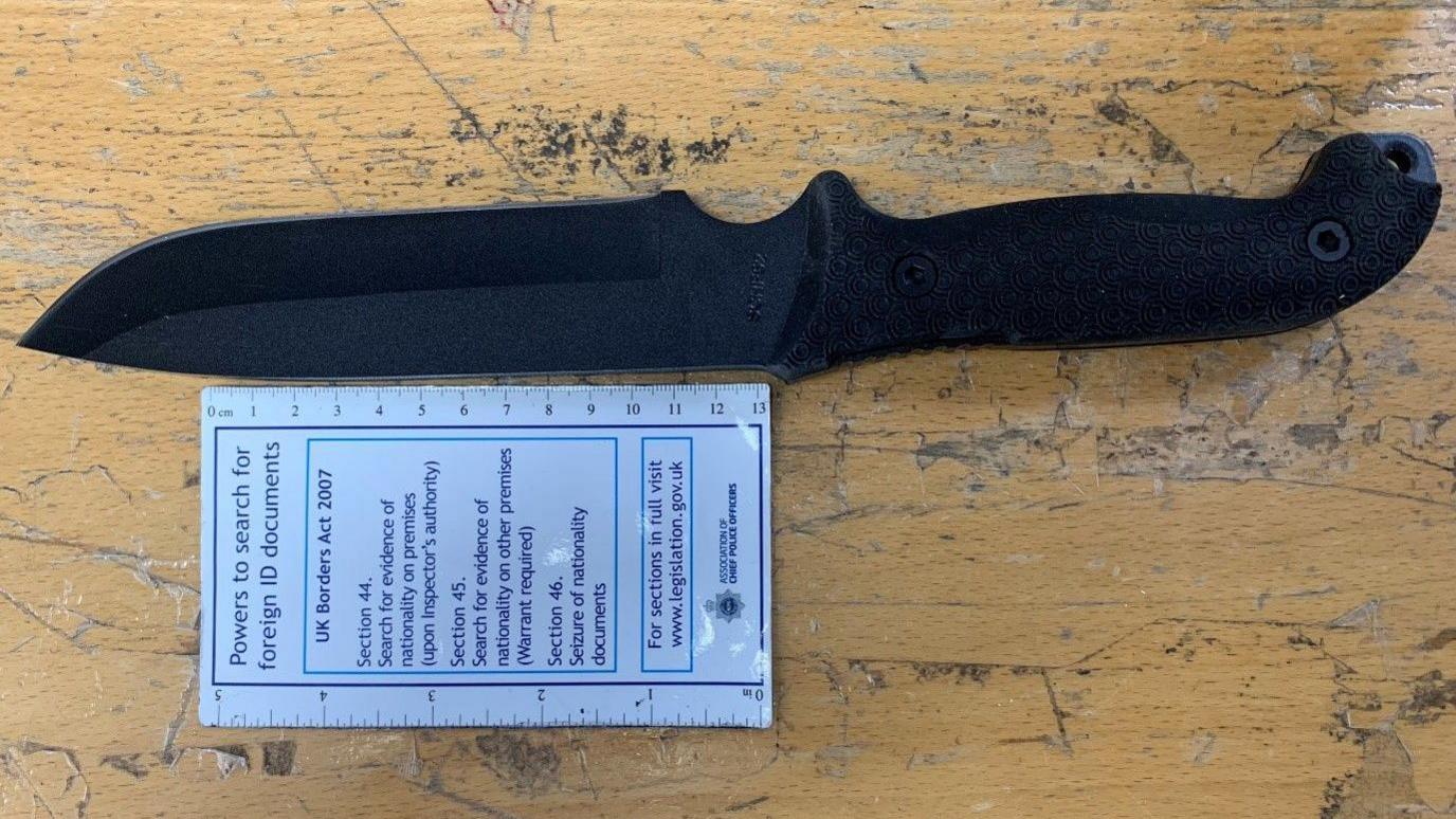 The black hunting knife carried by Cavan Medlock during his attack on the law firm