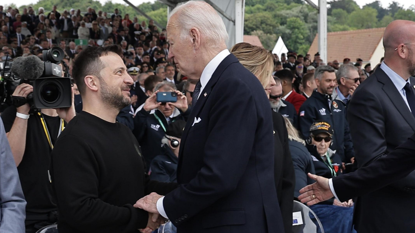 Ukrainian President Volodymyr Zelensky (left) and US President Joe Biden shake hands at the D-Day commemoration ceremony in northern France. Photo: 6 June 2024