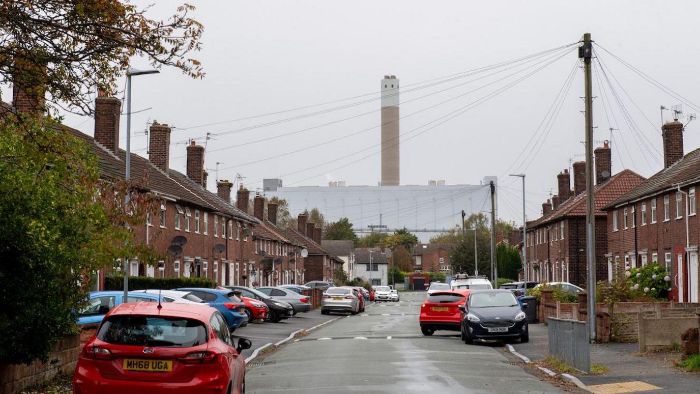 The waste incinerator at Runcorn, seen at the end of a street with houses on either side