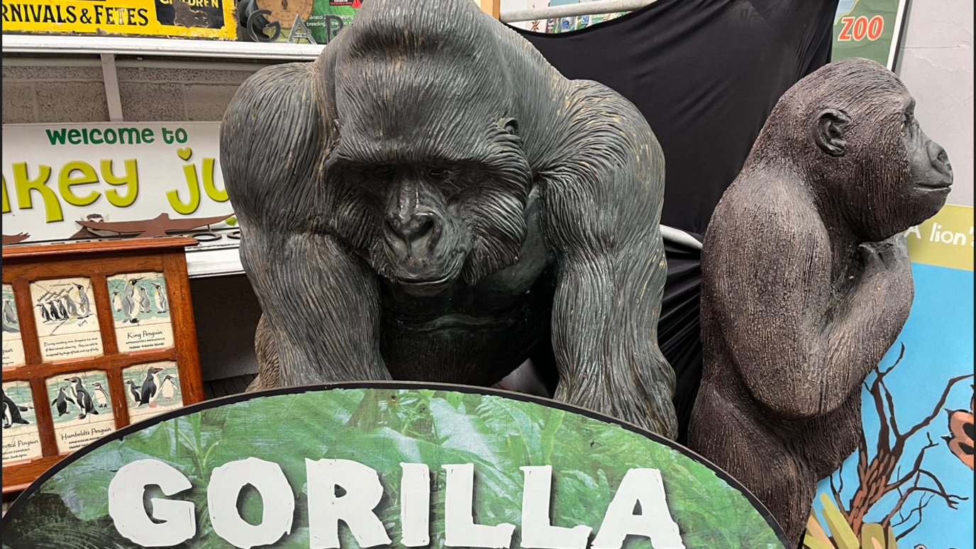 Two large gorilla sculptures that are for sale in the auction