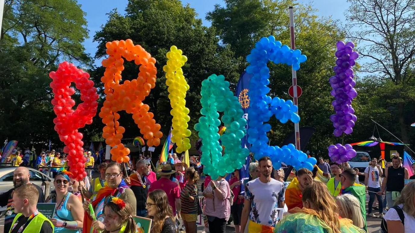 People taking part in a previous Pride in Surrey parade