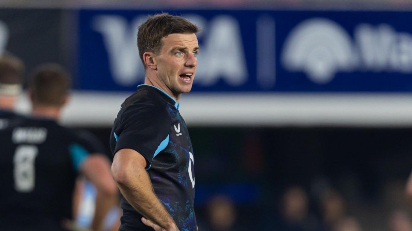 George Ford looks off to the right of the frame