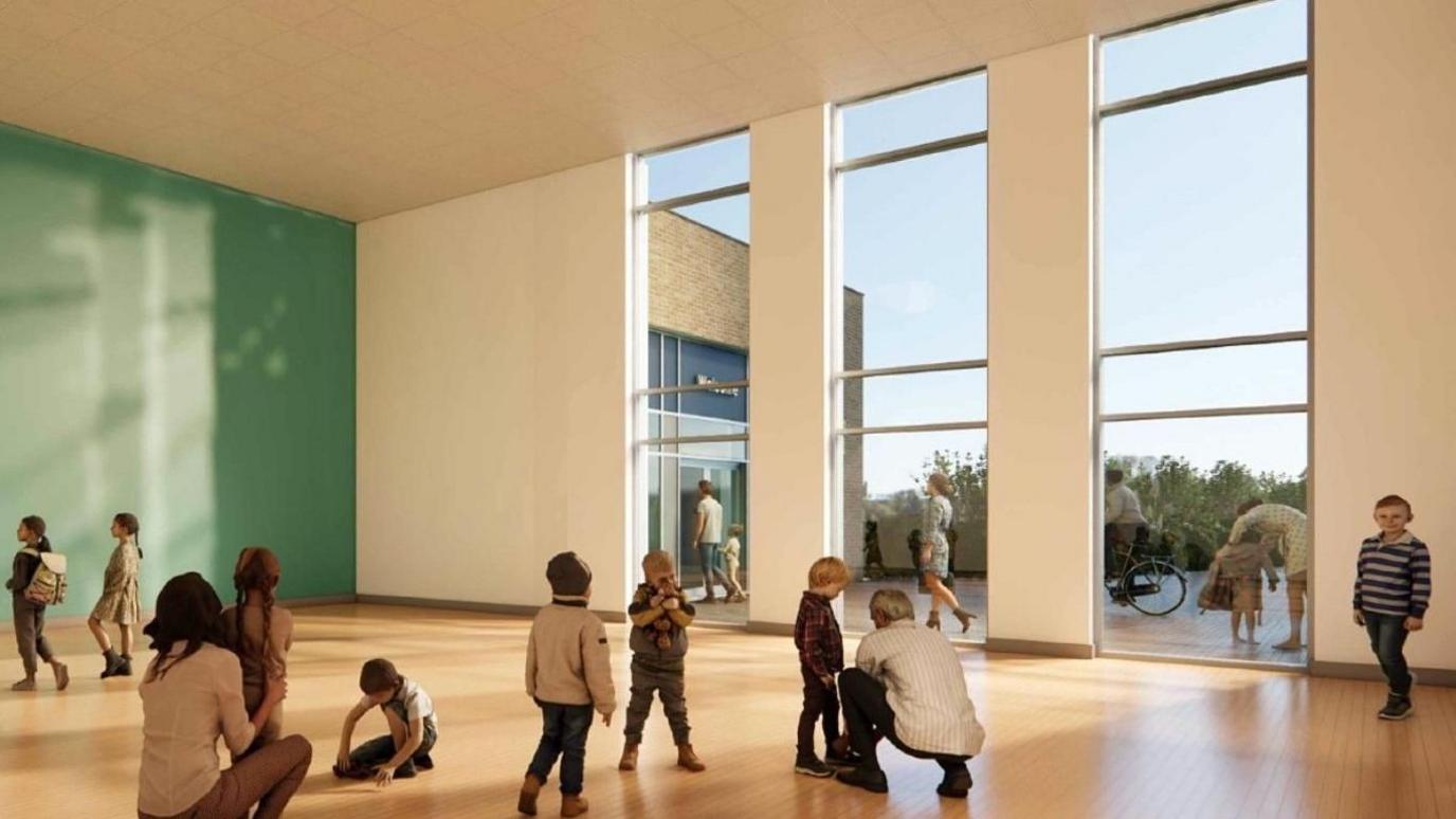 A CGI image showing how the school could look from the inside. Adults and children are in a room, with others visible outside, through windows. 