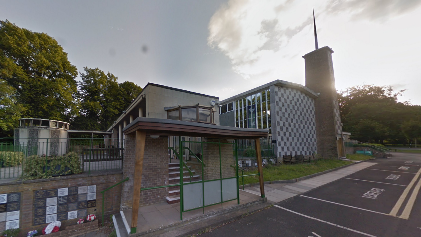 Salisbury crematorium outside view of building near shelter and steps and car park. 