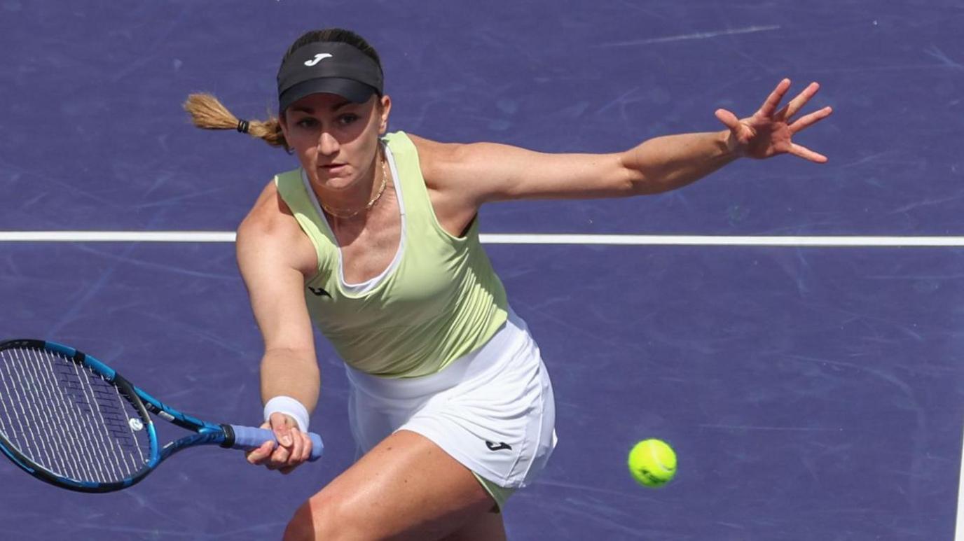 Britain's Olivia Nicholls hits a forehand return at Indian Wells