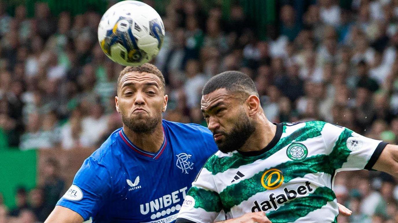 Cyriel Dessers and Cameron Carter-Vickers challenge for the ball