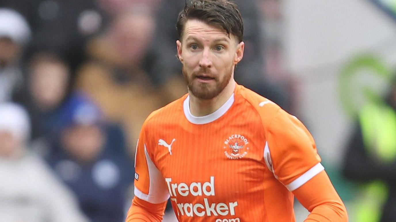 James Husband in action for Blackpool
