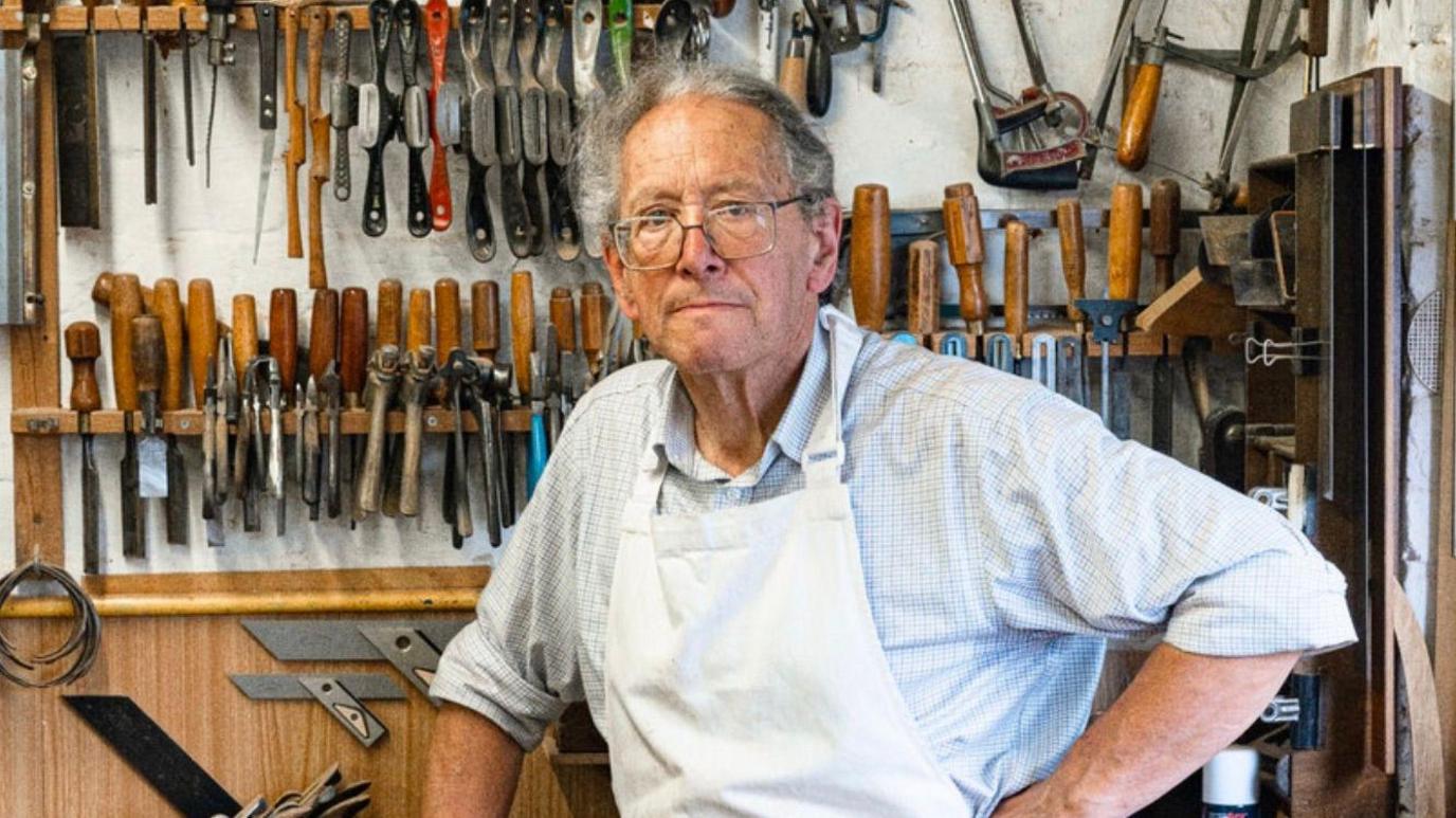 Tim Constable standing in his workshop.