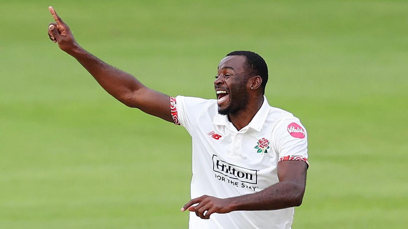 Anderson Phillip celebrating after taking a wicket for Lancashire in September.