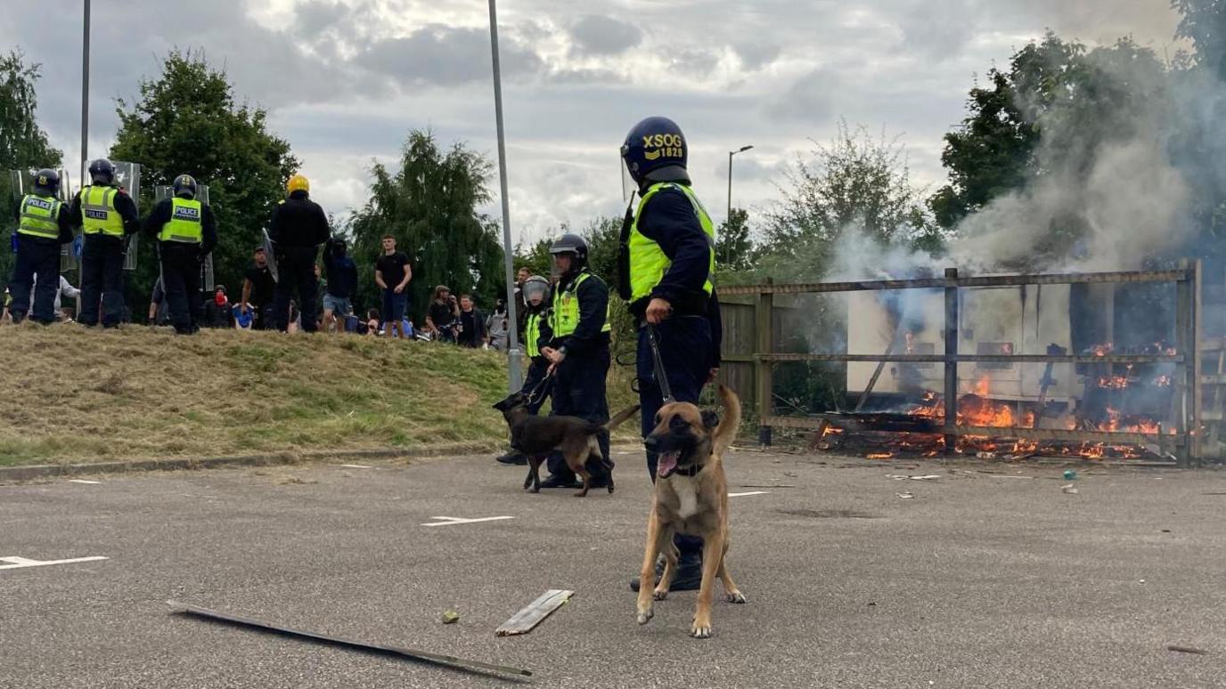 A police dog outside the Holiday Inn Express hotel in Manvers