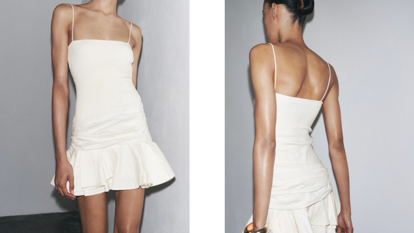A model with brown hair poses in a short white ruffled dress with shadows appearing to make her legs look thinner