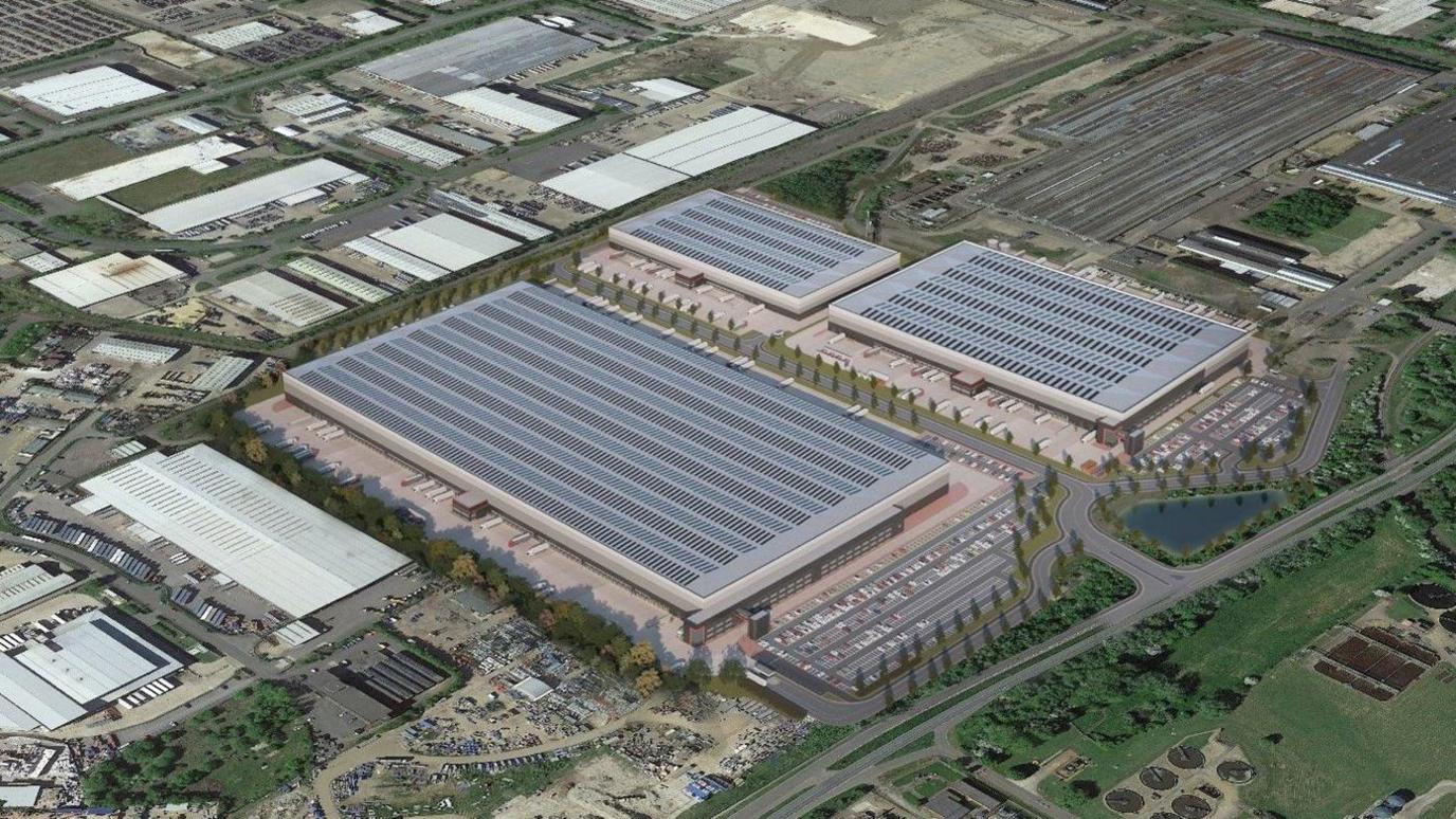 Aerial shot showing three new large buildings surrounded by roads and car parks