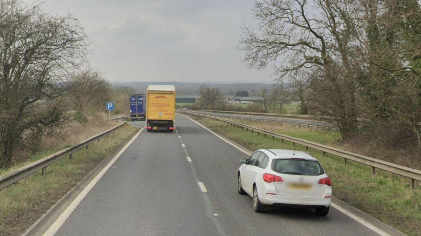 A generic image of the A45 in Ryton. There is a white car and a DHL truck. 