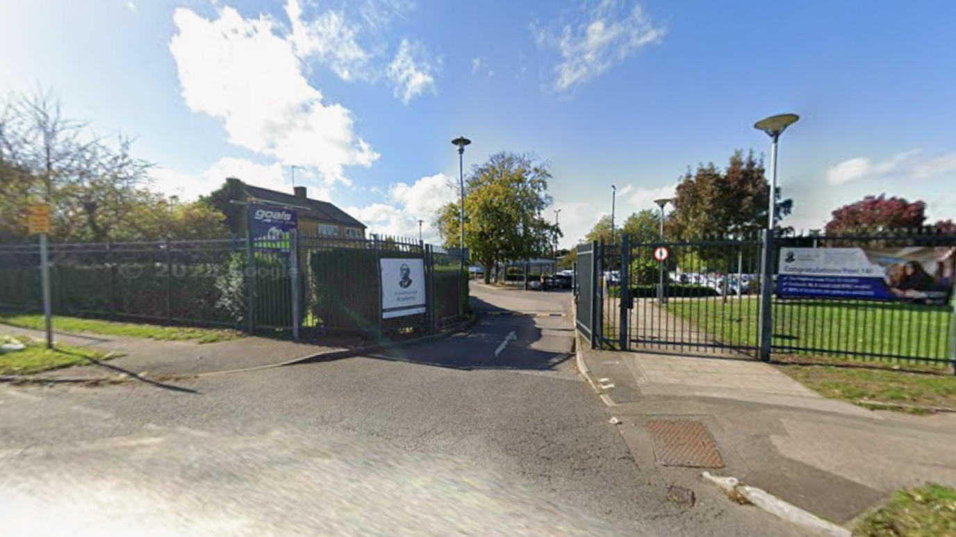 The entrance of a school on a sunny day.
