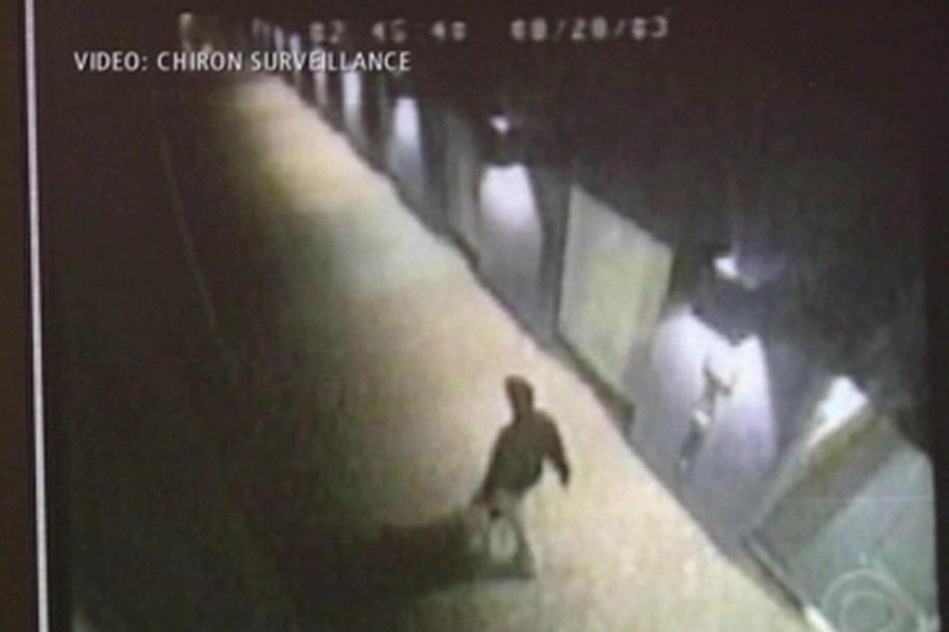 A silhouette of a person in the dark is on CCTV walking in a dimly light area of the former Chiron Life Science Center in Emeryville, near Oakland, in California on 28 August 2003