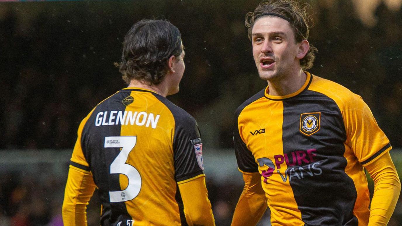 Harrison Biggins of Newport County celebrates scoring a goal