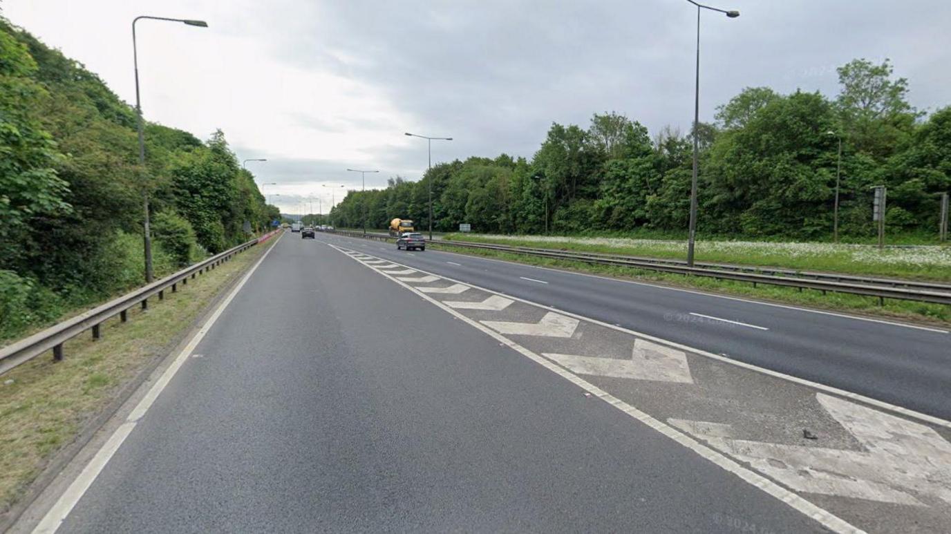 A Google street view image from a slip road onto a dual carriageway. Cars can be seen driving on either side