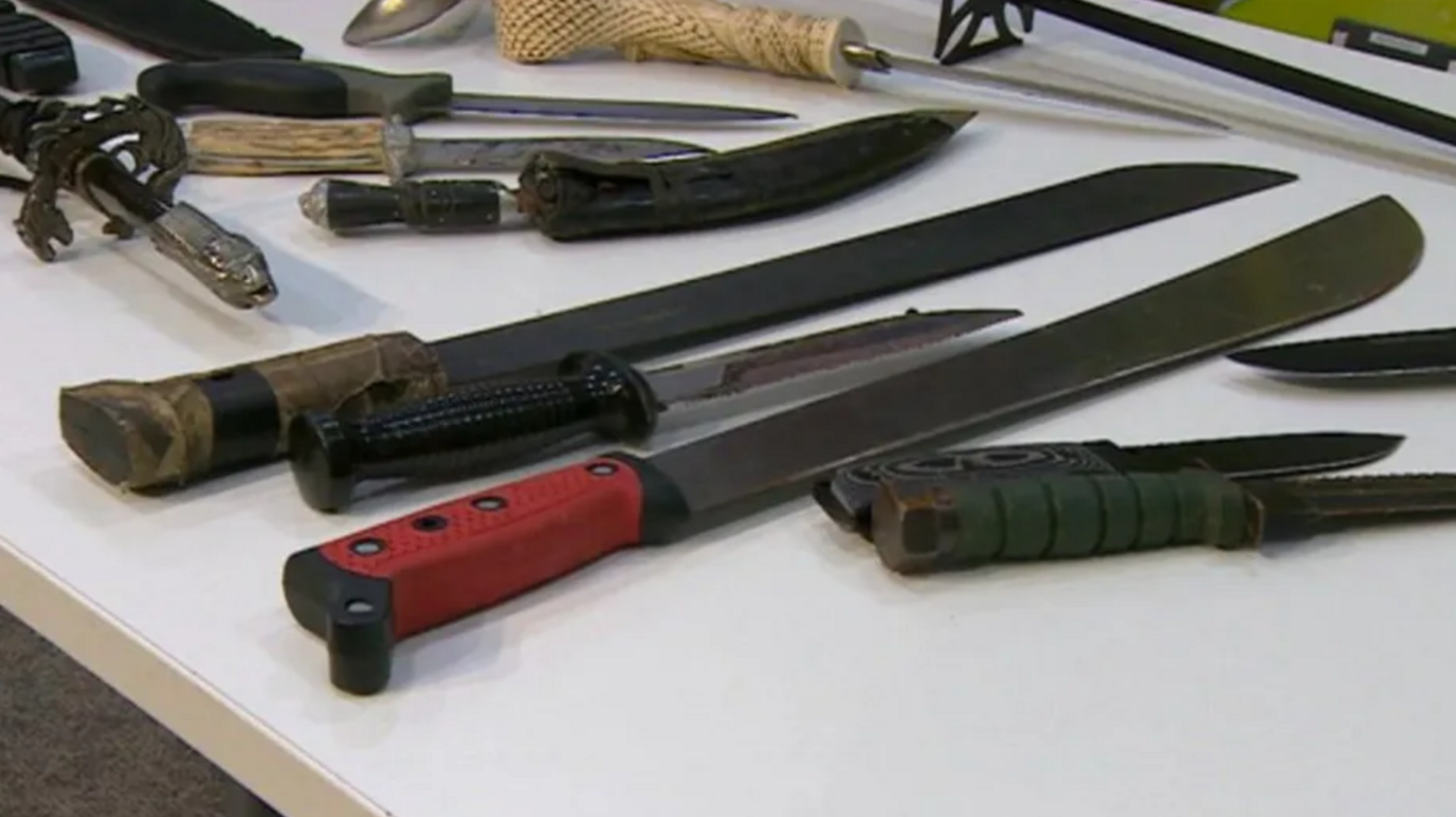 A selection of bladed weapons on a white table