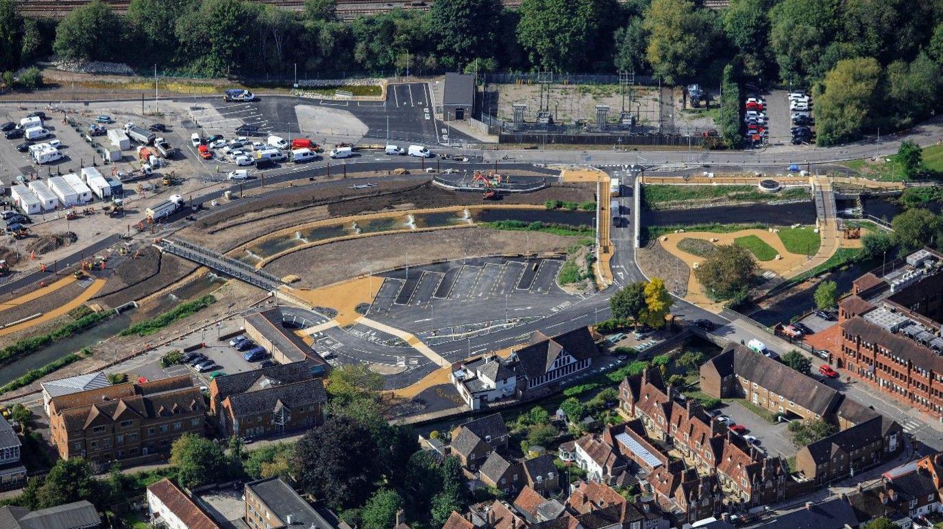 An aerial view of the new coach park in Salisbury showing coach spaces and surrounding carparks near rows of terraced housing