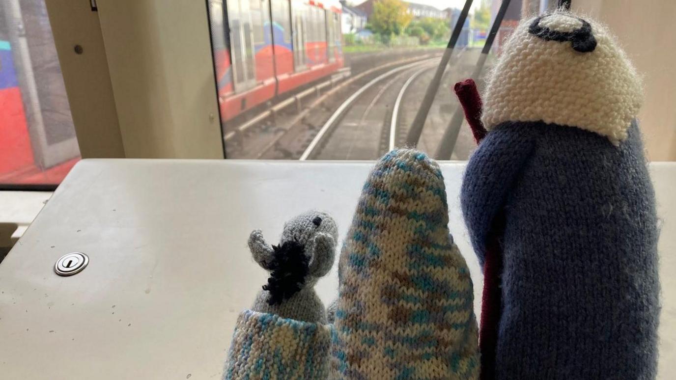 Miniature knitted figurines of Mary, Joseph and a donkey on the London travel network.