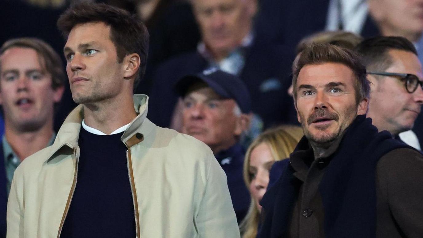 Tom Brady (L), minority owner of Birmingham City stood next to David Beckham 