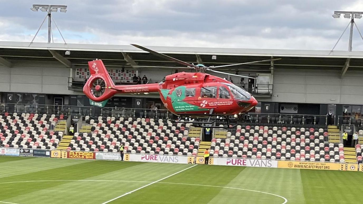 An air ambulance lands on the Rodney Parade 