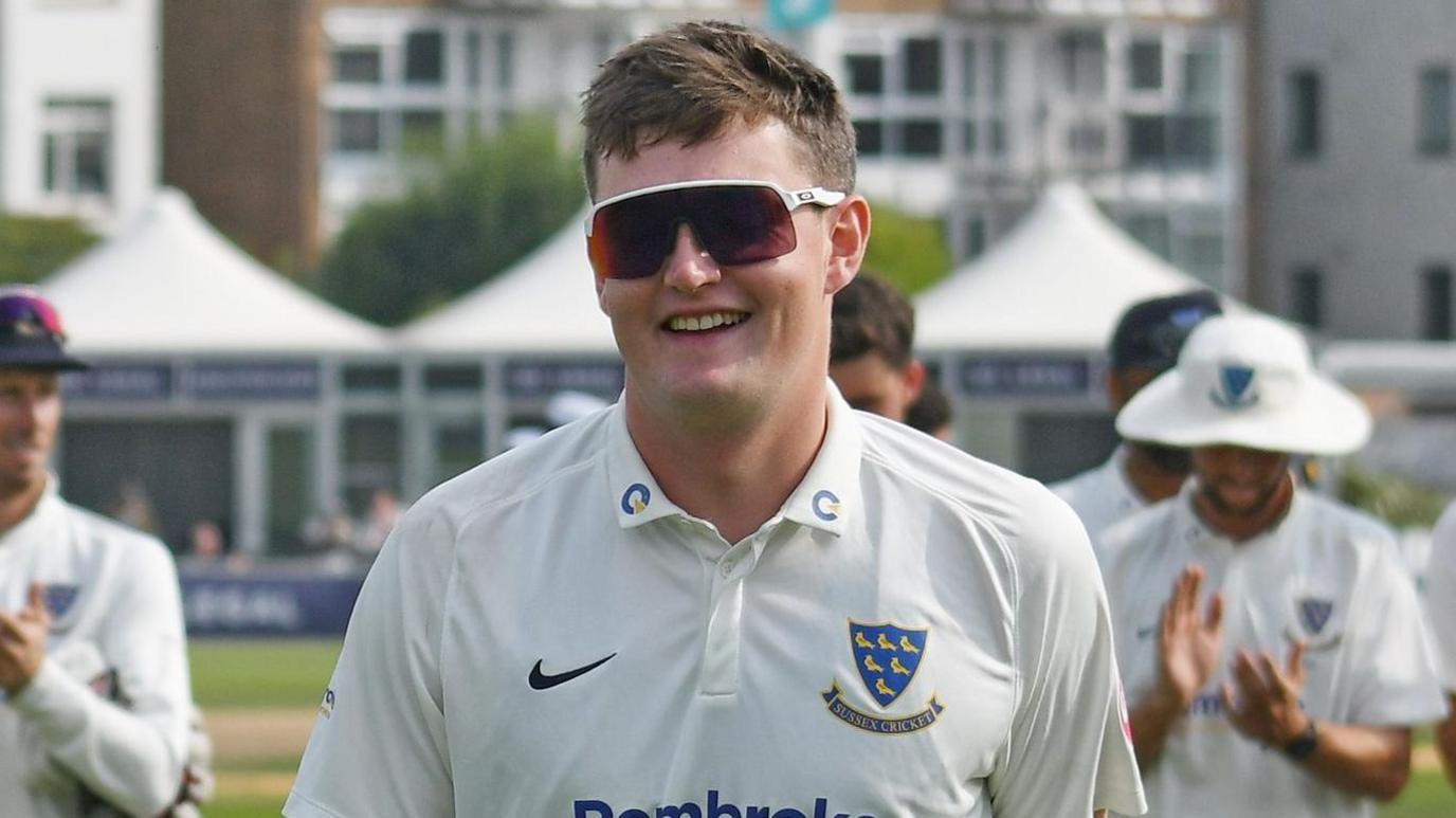 Sussex spinner Jack Carson is applauded off the pitch after a match against Derbyshire in Hove