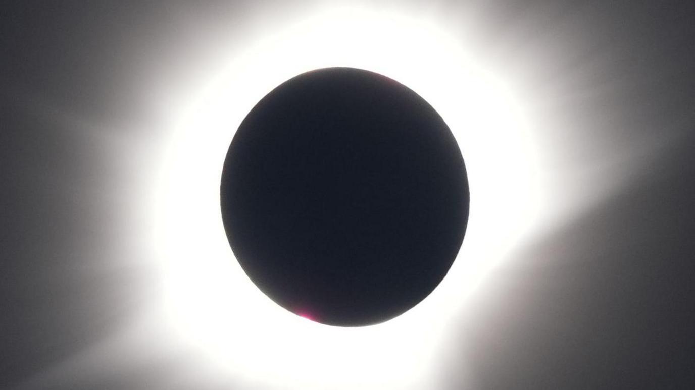 A view of the total eclipse, as the Moon passes between the Earth and the Sun, as seen from on board the Ambassador cruise ship Ambition, off the coast of Greenland.