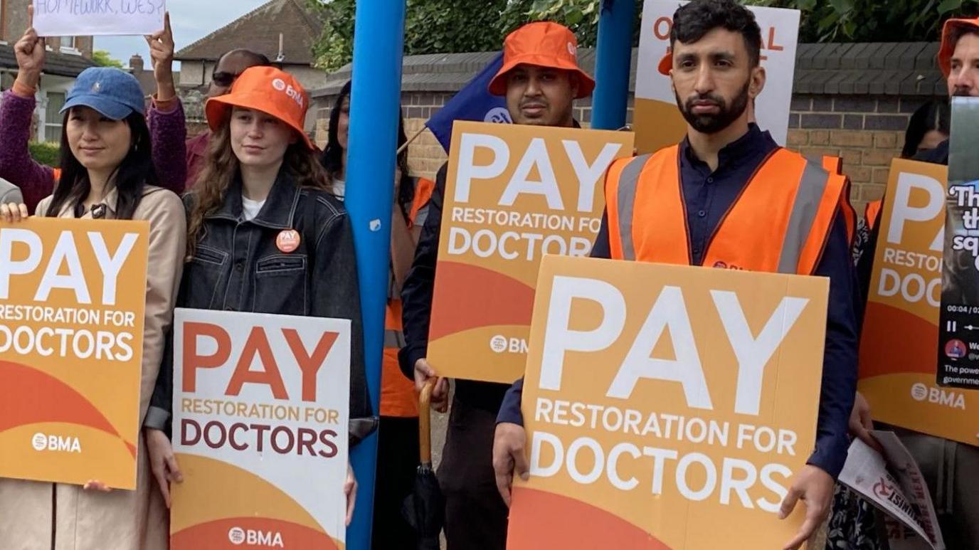 Dr Shivam Sharma, right, at a picket line