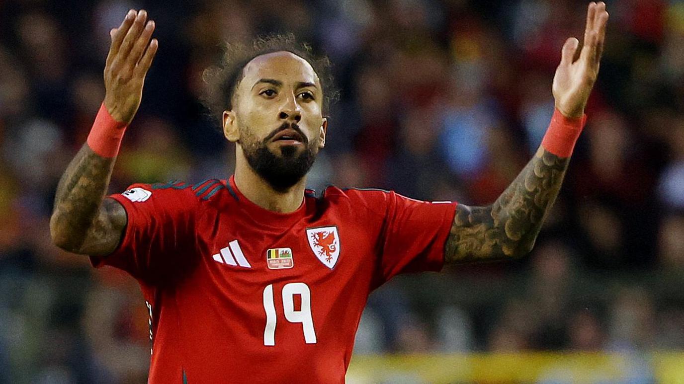 Sorba Thomas playing for Wales against Belgium in Brussels