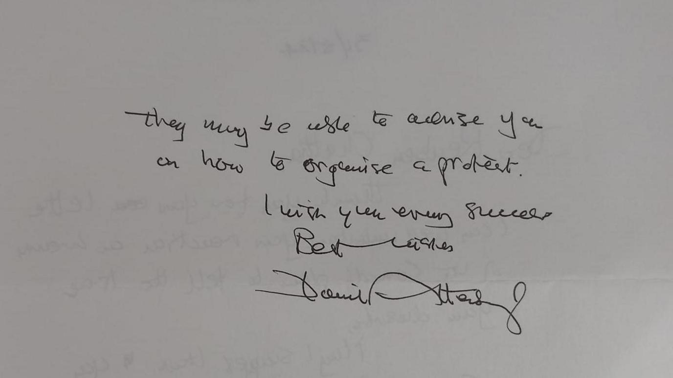 A close up of a letter, which reads: they may be able to advise you on how to organise a protest. I wish you every success. Best Wishes David Attenborough.