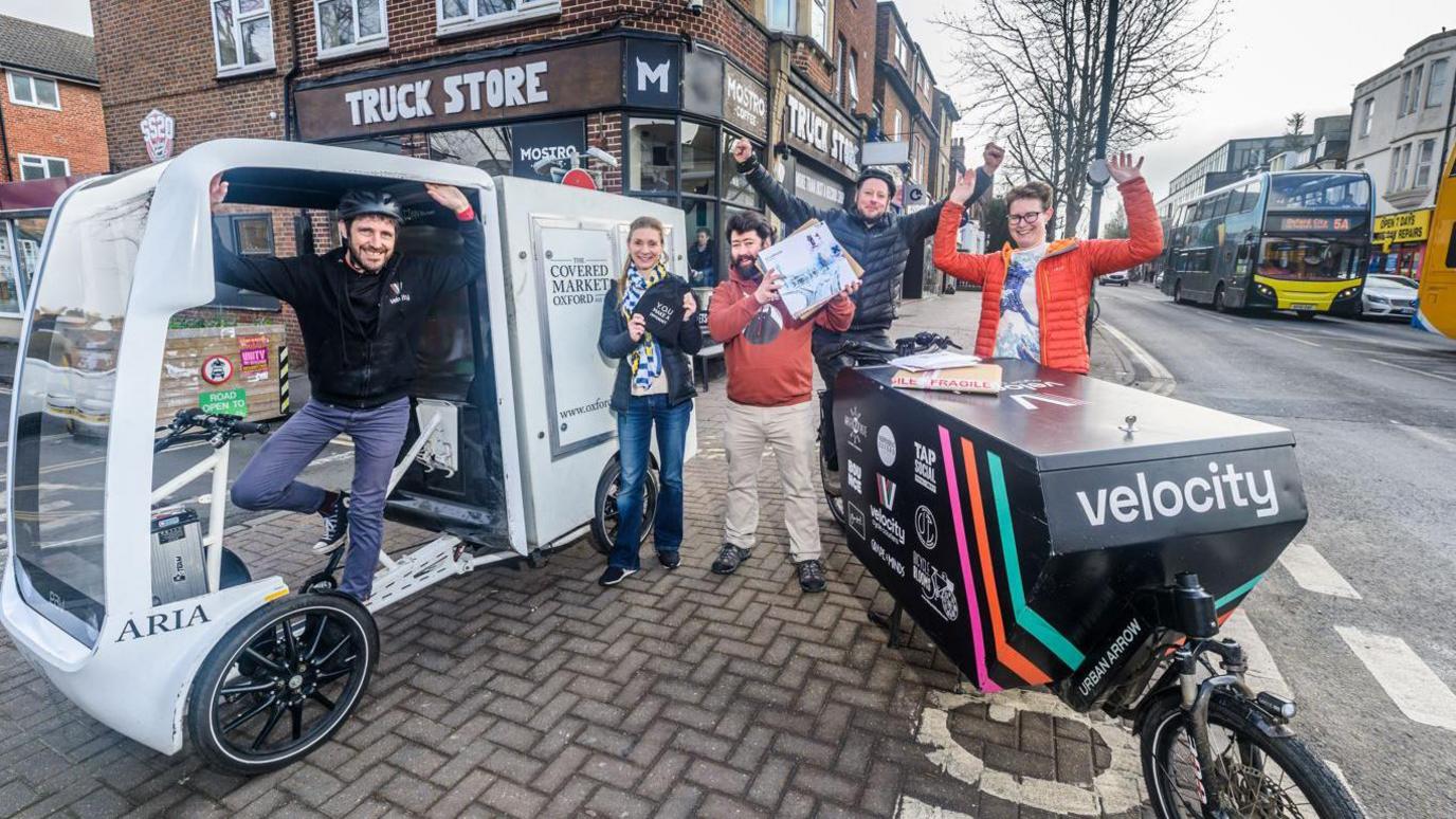 Cargo bike delivery driver with customers