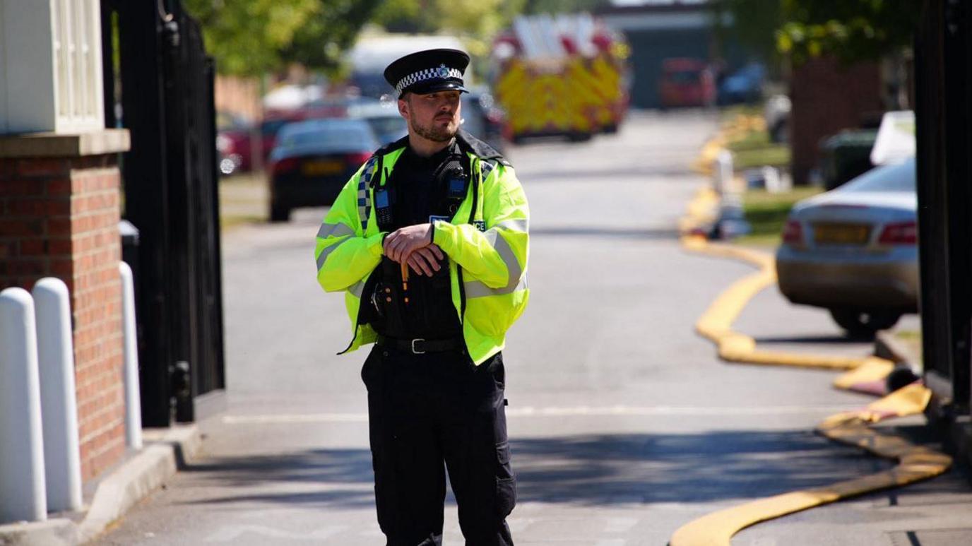 Police officer outside Bicester Motion.